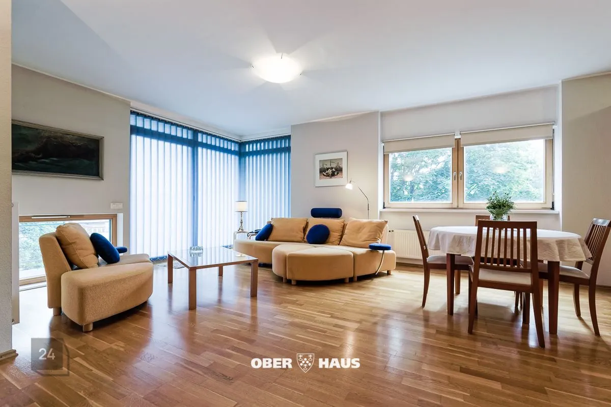 Apartment with balcony, fireplace and sauna. Parking space in the garage.